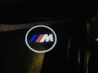 Подсветка логотипа в двери BMW,подсветка дверей с логотипом BMW,Штатная подсветка BMW,подсветка дверей с логотипом авто BMW,светодиодная подсветка логотипа BMW в двери,Лазерные проекторы BMW в двери,Лазерная подсветка BMW