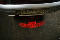 проектор на бампер DECEPTICON,проектор логотипа DECEPTICON для заднего бампера,проектор логотипа DECEPTICON на задний бампер,светодиодный проектор DECEPTICON,светодиодный проектор логотипа DECEPTICON,рекламный проектор DECEPTICON,след тени логотипа автомо